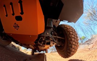 Off-road Kimberley Kampers motorhome with rugged tires on a dirt trail, designed for adventure and durability in remote Australian landscapes.