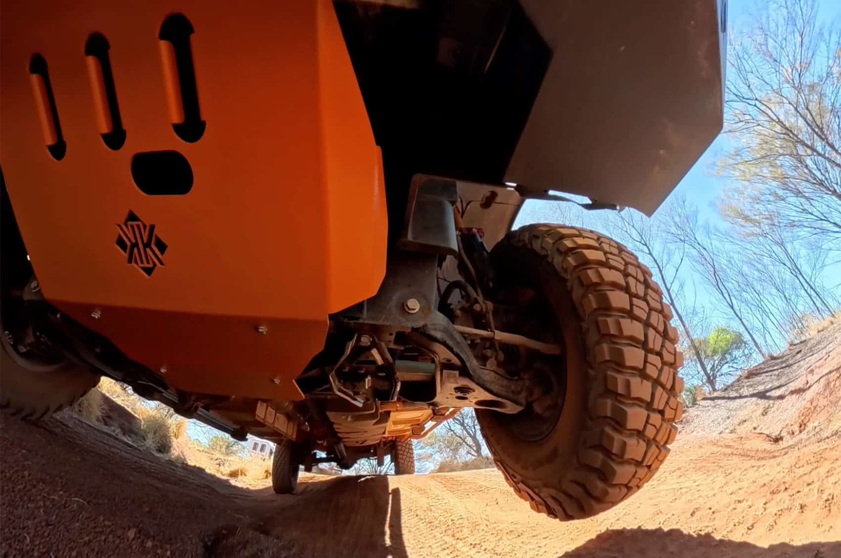 Off-road Kimberley Kampers motorhome with rugged tires on a dirt trail, designed for adventure and durability in remote Australian landscapes.